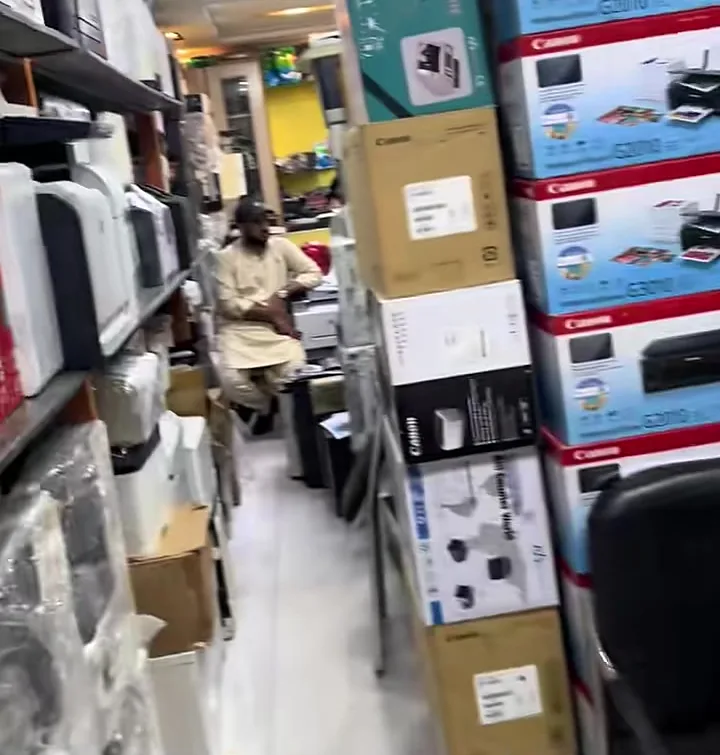 The aisle at Printer Hut, Hafeez Centre, stacked with boxed Canon and HP printers