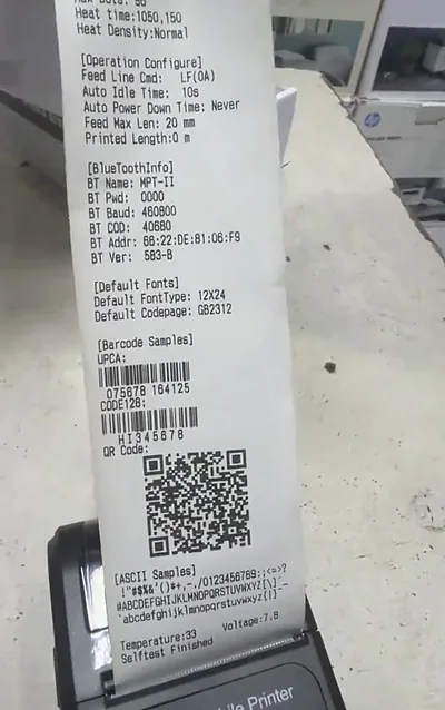 A portable thermal printer printing its self-test receipt at Printer Hut