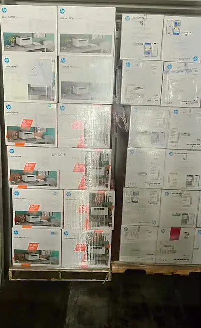 Pallets of boxed HP LaserJet printers arriving as new stock